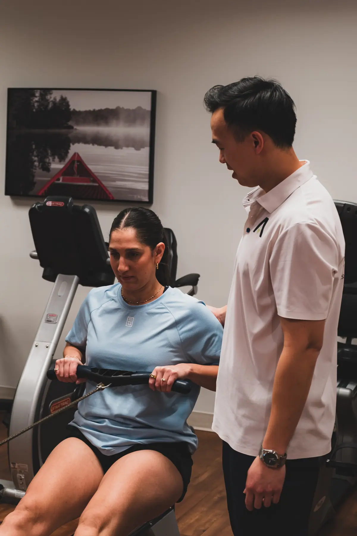 Physiotherapist guiding patient through exercise at Atrium clinic
